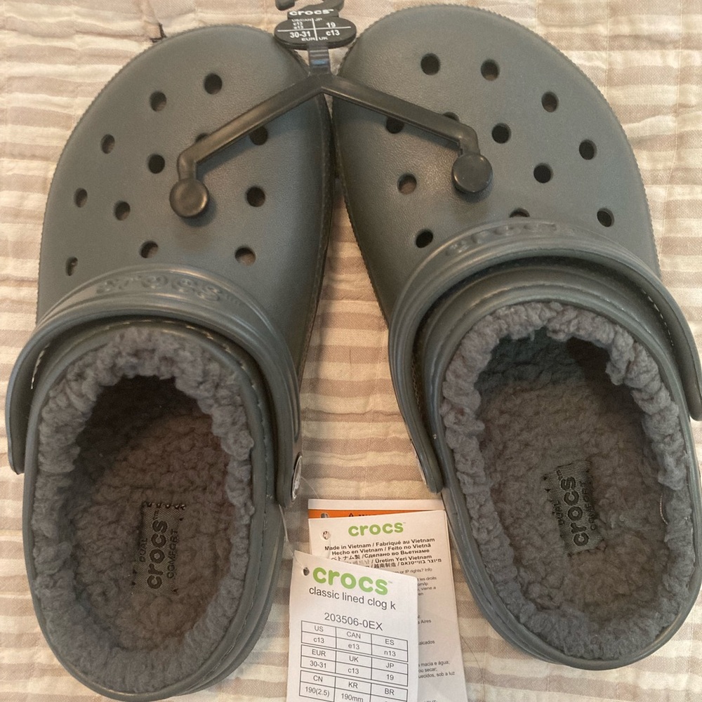 Dark gray lined Crocs, children’s size 13. NWT